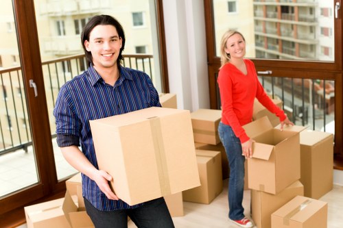 Packed student storage space with boxes and furniture in Sandsend